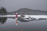 Santa Claus paddle boarding in Squaw Cove