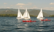 Sailboats and kayakers on Squam