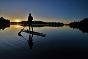 Sunrise paddle boarder in Rattlesnake Cove